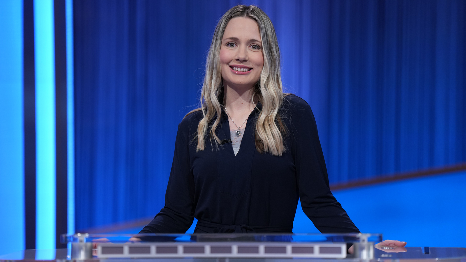 Alison Betts behind the Jeopardy! contestant podium