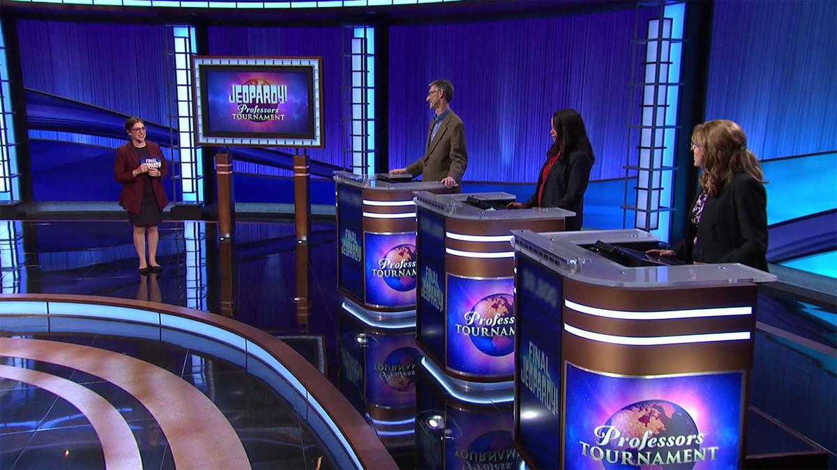 Mayim Bialik on the Jeopardy! stage with contestants J.P. Allen, Alisa Hove, and Deborah Steinberger.
