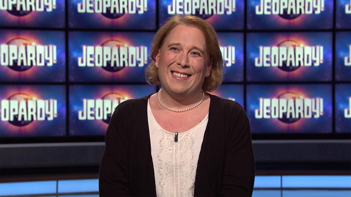 Amy Schneider in front of the Jeopardy! TV screens