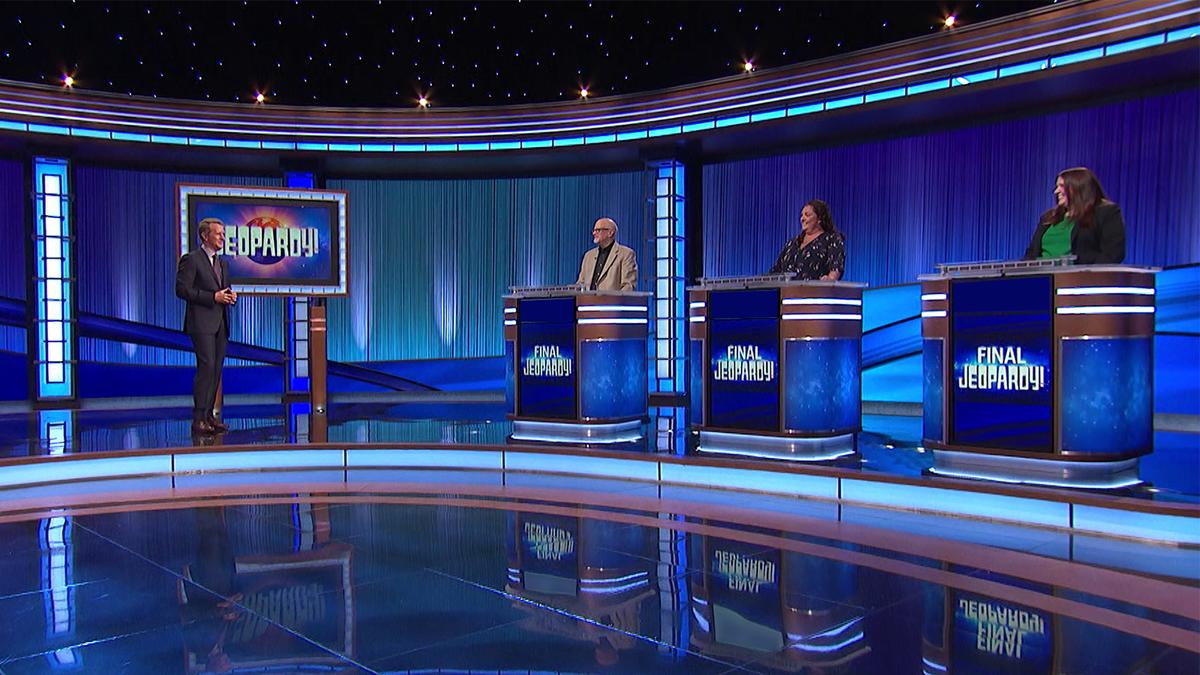 Ken Jennings and contestants Ed Coulson, Colleen Birney, and Brianne Barker on the set of Jeopardy!