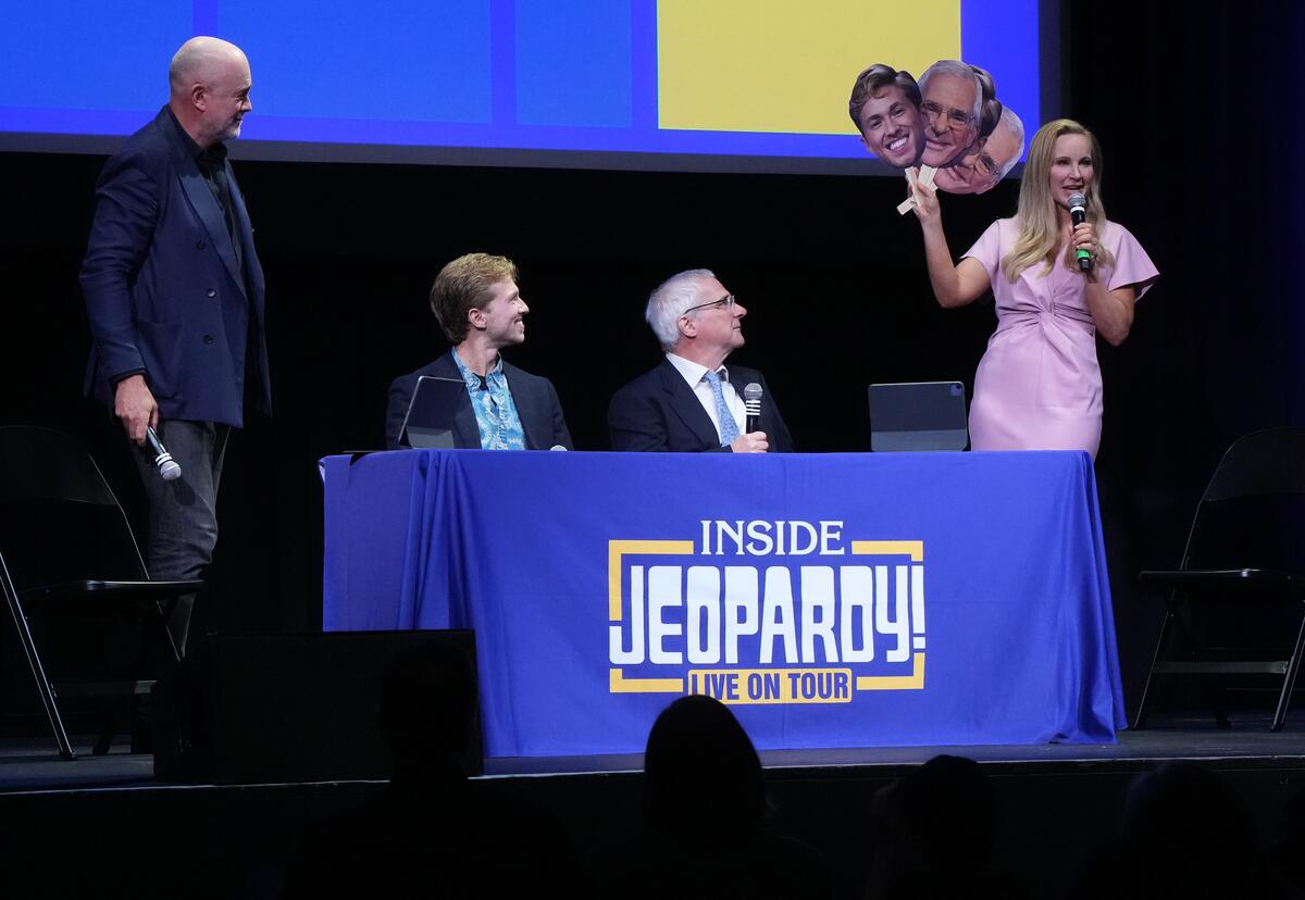 Micheal Davies, Drew Goins, Sam Buttrey and Sarah Whitcomb Foss on stage at the Lincoln Theatre in Washington, D.C. during a live taping of Inside Jeopardy!.