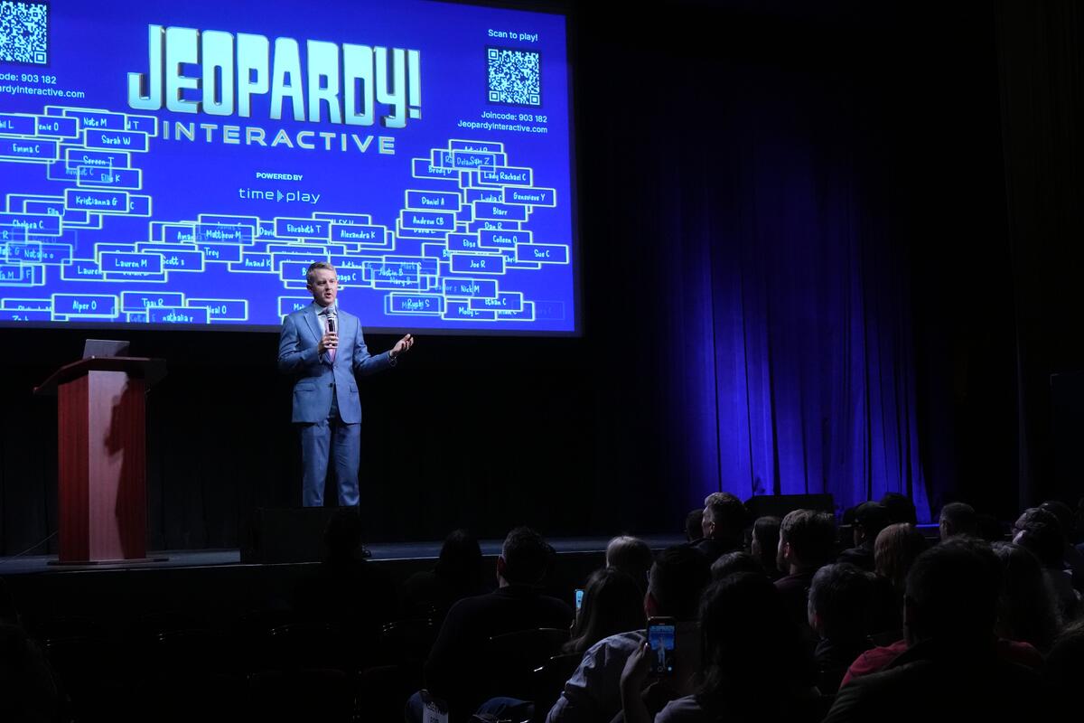 Ken Jennings hosting an interactive version of Jeopardy! on the Inside Jeopardy! Live Tour. 
