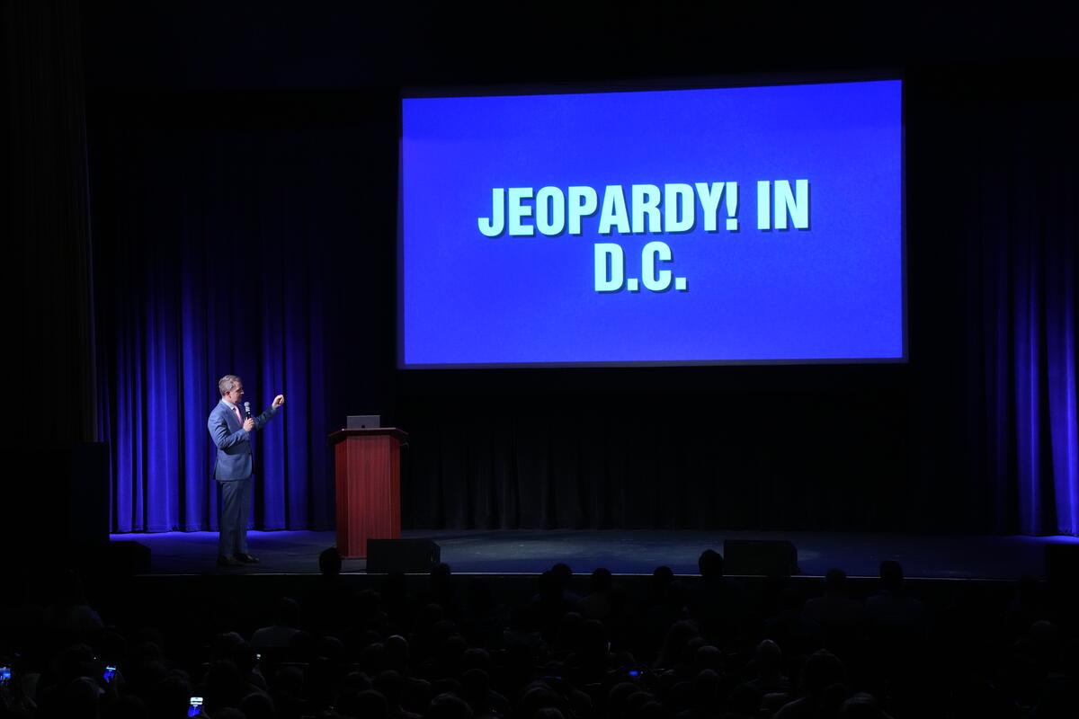 Ken Jennings hosting an interactive version of Jeopardy! on the Inside Jeopardy! Live Tour. 