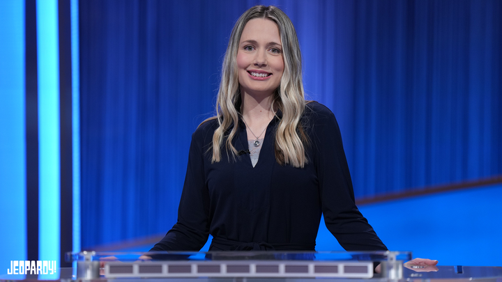 Alison Betts behind the Jeopardy! contestant podium