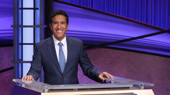 Dr. Sanjay Gupta behind the Jeopardy! lectern