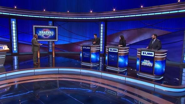 Guest host LeVar Burton and contestants Matt Amodio, Dana Rosner and Bryan Cracchiolo on the Jeopardy! set. 