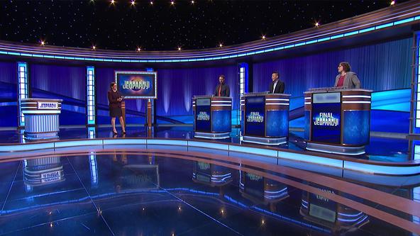 Host Mayim Bialik and contestants Brian Ahern, Robert Won, Leigh Jahnig on the set of Jeopardy!