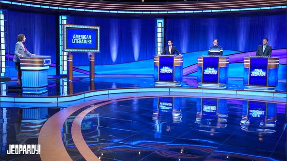 Host Mayim Bialik with the High School Reunion Tournament contestants Lucas Miner, Jackson Jones, and Avi Gupta on the Alex Trebek Stage.