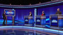 Ken Jennings and contestants on the Jeopardy! stage