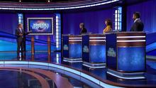 Ken Jennings and contestants on the Jeopardy! stage