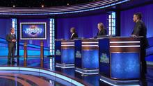Ken Jennings and the contestants on stage.