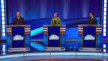 Dave Bzdak, Eleanor Dixon, and Shayan Sadegh on stage