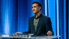 Suresh Krishnan stands behind the contestant podium