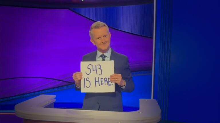 Ken Jennings holding a sign